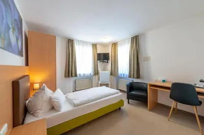 Ein Bett oder Betten in einem Zimmer der Unterkunft Frühstückspension Haus Ahamer