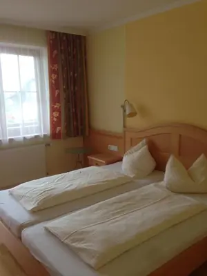 Ein Bett oder Betten in einem Zimmer der Unterkunft Peterwirt