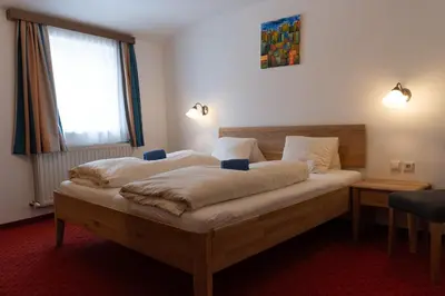 Ein Bett oder Betten in einem Zimmer der Unterkunft Hotel Pension Kandolf