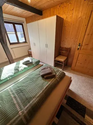 Ein Bett oder Betten in einem Zimmer der Unterkunft Haus-Ennstal