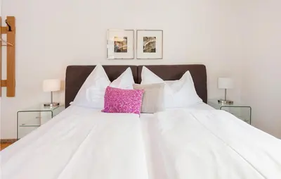 Ein Bett oder Betten in einem Zimmer der Unterkunft Ferienwohnung-Walserhaus