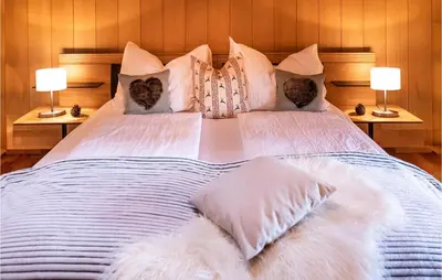 Ein Bett oder Betten in einem Zimmer der Unterkunft Ferienwohnung Im Walserhaus