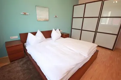 Ein Bett oder Betten in einem Zimmer der Unterkunft Apart 15 by Alpenidyll Apartments