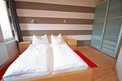 Ein Bett oder Betten in einem Zimmer der Unterkunft Apart 13 by Alpenidyll Apartments