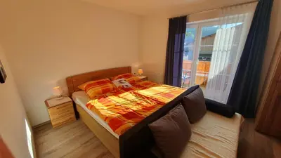 Ein Bett oder Betten in einem Zimmer der Unterkunft Apartman Tauplitz skiing, hiking, bike, cross country - Haus Sandlweber