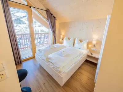 Ein Bett oder Betten in einem Zimmer der Unterkunft Kreischberg W19