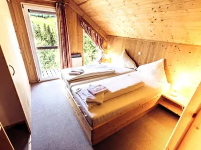 Ein Bett oder Betten in einem Zimmer der Unterkunft Kreischberg W7