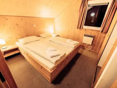 Ein Bett oder Betten in einem Zimmer der Unterkunft Kreischberg W2