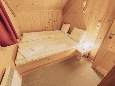 Ein Bett oder Betten in einem Zimmer der Unterkunft Kreischberg W2