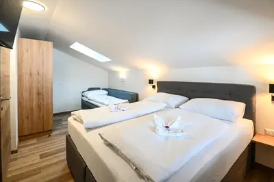 Ein Bett oder Betten in einem Zimmer der Unterkunft Club House by Schladming-Appartements