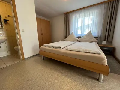 Ein Bett oder Betten in einem Zimmer der Unterkunft Gästehaus Jedinger