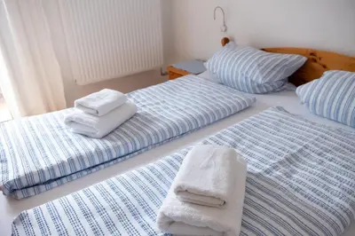Ein Bett oder Betten in einem Zimmer der Unterkunft Haus Alpenrose Obertraun