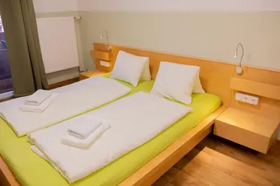 Ein Bett oder Betten in einem Zimmer der Unterkunft Haus Alpenrose Obertraun
