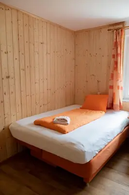 Ein Bett oder Betten in einem Zimmer der Unterkunft Haus Alpenrose Obertraun