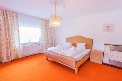 Ein Bett oder Betten in einem Zimmer der Unterkunft Hoamathaus by Alpenidyll Apartments
