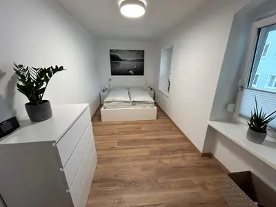 Ein Bett oder Betten in einem Zimmer der Unterkunft Ferienwohnung Gmunden City