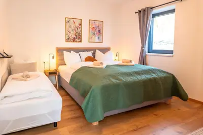 Ein Bett oder Betten in einem Zimmer der Unterkunft Höhenweg Appartement & Ferienwohnung