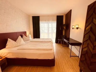 Ein Bett oder Betten in einem Zimmer der Unterkunft Gästehaus am Stadtpark