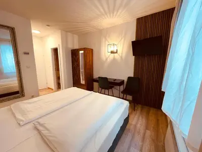 Ein Bett oder Betten in einem Zimmer der Unterkunft Gästehaus am Stadtpark
