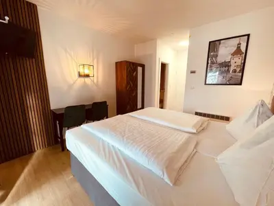 Ein Bett oder Betten in einem Zimmer der Unterkunft Gästehaus am Stadtpark
