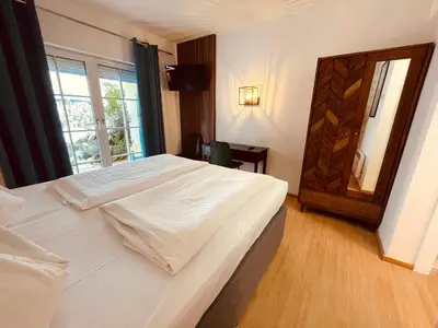 Ein Bett oder Betten in einem Zimmer der Unterkunft Gästehaus am Stadtpark