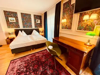 Ein Bett oder Betten in einem Zimmer der Unterkunft Gästehaus am Stadtpark