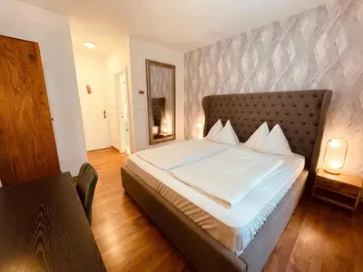Ein Bett oder Betten in einem Zimmer der Unterkunft Gästehaus am Stadtpark