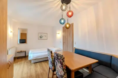 Ein Bett oder Betten in einem Zimmer der Unterkunft Appartementhaus Christophorus