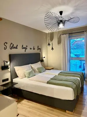 Ein Bett oder Betten in einem Zimmer der Unterkunft Das Genner - Boutique Appartement