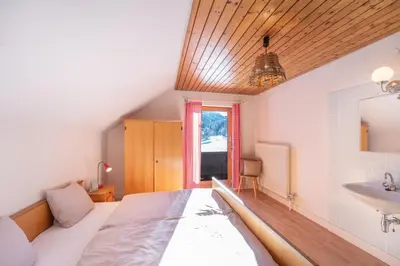 Ein Bett oder Betten in einem Zimmer der Unterkunft Appartementhaus Schmalzermoos