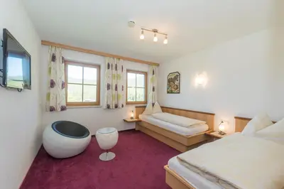 Ein Bett oder Betten in einem Zimmer der Unterkunft Blasbichlerhof