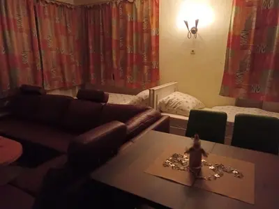 Ein Sitzbereich in der Unterkunft Zimmer Kropfmoar