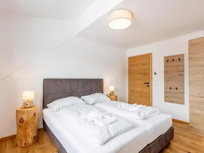 Ein Bett oder Betten in einem Zimmer der Unterkunft Lärchenhof Top 301
