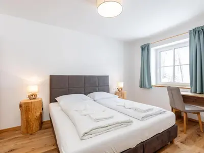 Ein Bett oder Betten in einem Zimmer der Unterkunft Lärchenhof Top 203