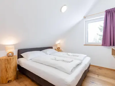 Ein Bett oder Betten in einem Zimmer der Unterkunft Lärchenhof Top 302