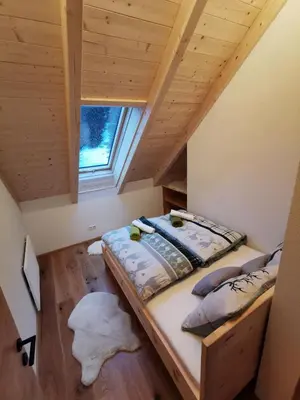 Ein Bett oder Betten in einem Zimmer der Unterkunft ALMNEST - LACHTAL