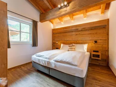 Ein Bett oder Betten in einem Zimmer der Unterkunft Wagrainer TauernLodge 42A
