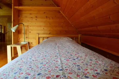Ein Bett oder Betten in einem Zimmer der Unterkunft Roseggerhaus