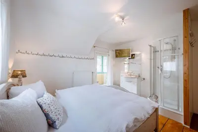 Ein Bett oder Betten in einem Zimmer der Unterkunft Ferienhaus Ennstal