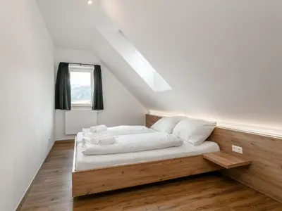 Ein Bett oder Betten in einem Zimmer der Unterkunft NRV Top 7