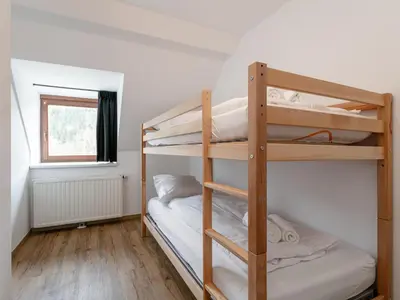 Ein Bett oder Betten in einem Zimmer der Unterkunft NRV Top 5