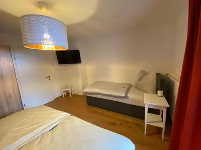 Ein Bett oder Betten in einem Zimmer der Unterkunft Herzzeit Apartments