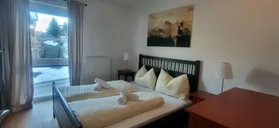 Ein Bett oder Betten in einem Zimmer der Unterkunft Dachsteinblick by Alpendyll Apartments