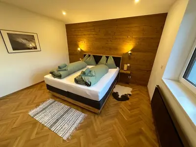 Ein Bett oder Betten in einem Zimmer der Unterkunft Edelweiss Lodge