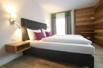 Ein Bett oder Betten in einem Zimmer der Unterkunft Kia Ora Hotel Restaurant