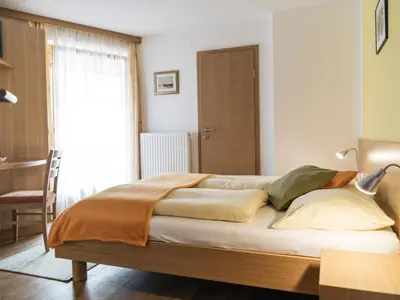 Ein Bett oder Betten in einem Zimmer der Unterkunft Privatzimmer und Ferienwohnungen Gassner