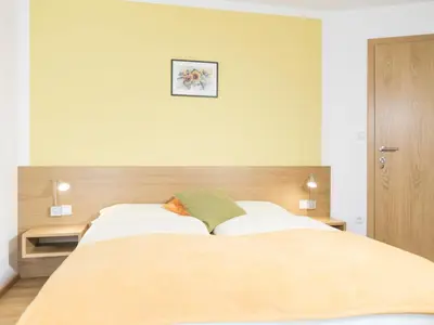 Ein Bett oder Betten in einem Zimmer der Unterkunft Privatzimmer und Ferienwohnungen Gassner