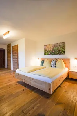 Ein Bett oder Betten in einem Zimmer der Unterkunft Brettmaisserhof