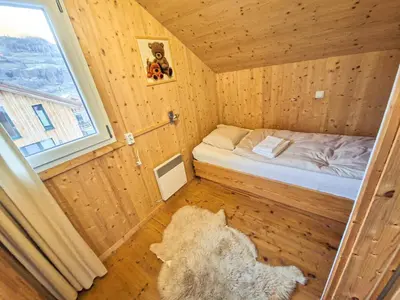 Ein Bett oder Betten in einem Zimmer der Unterkunft Kreischberg 14b - Chalet direkt am Skilift