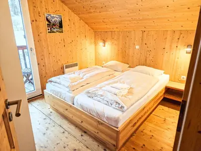 Ein Bett oder Betten in einem Zimmer der Unterkunft Kreischberg 14b - Chalet direkt am Skilift